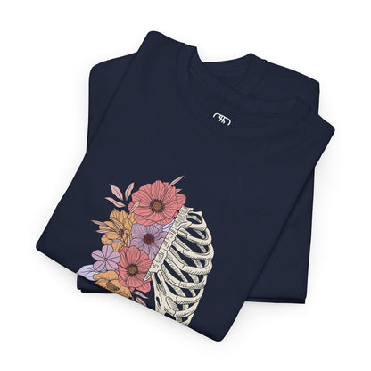 Folded Navy T-shirt with a lung graphic, half skeletal ribcage, half flowers.