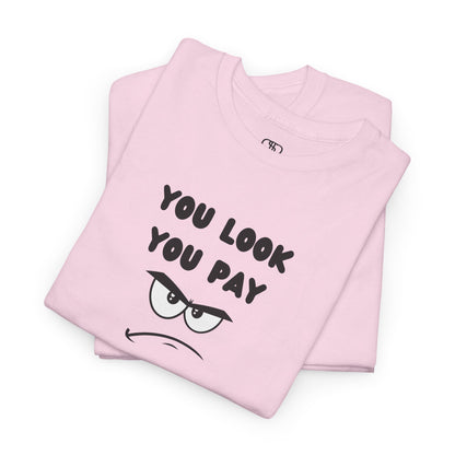 A folded pink T-shirt with "You Look You Pay" text and an angry cartoon graphic with scrunched eyebrows.
