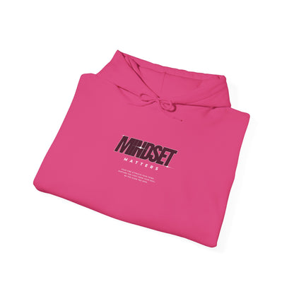 A folded pink hoodie "Mindset Matters" text with stars on hoodie, with an inspirational quote below.