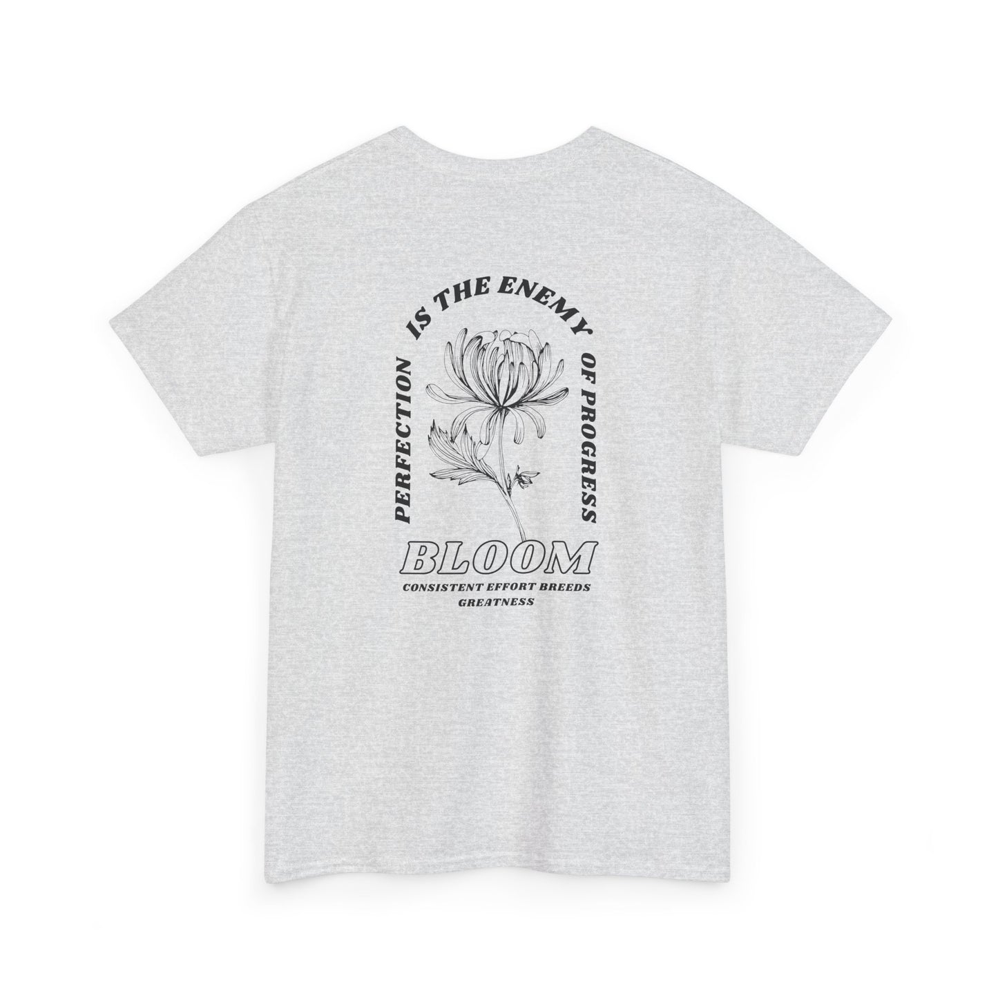 An [Ash Gray] t-shirt with a central flower design and the words “Perfection is the enemy of progress” and “Bloom” underneath it the phrase "Consistent effort breeds greatness," featured on the back of the t-shirt.