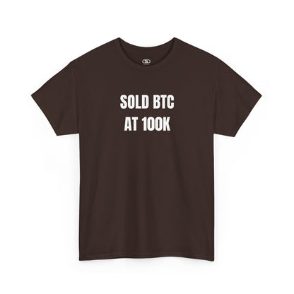 A dark brown T-shirt with bold text "SOLD BTC At 100K" on the front.